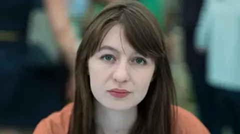 Sally Rooney states she will not enter the UK over legal concerns